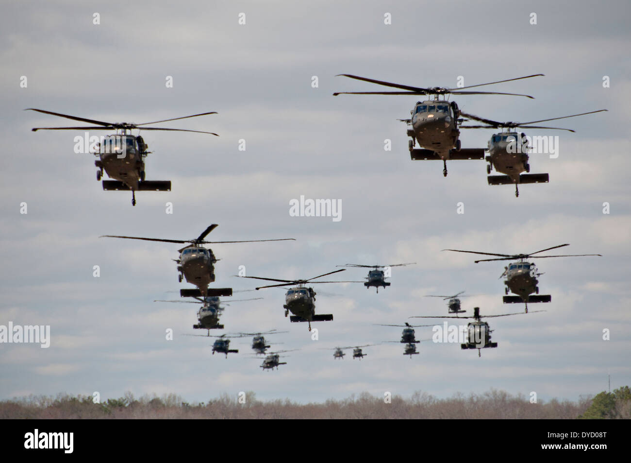 US Army UH 60 Black Hawk helicopters conduct a mass air assault with soldiers from the 101st Airborne Division during Operation Golden Eagle April 8, 2014 in Fort Campbell, Kentucky. Stock Photo