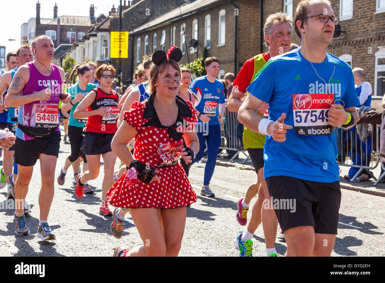 London UK. 13 April 2014 London Virgin Money Marathon runner 54745 Jackie Scarfe of Great Britain running as Minnie Mouse in a red polka dot outfit Credit:  John Henshall/Alamy Live News JMH6154 Stock Photo