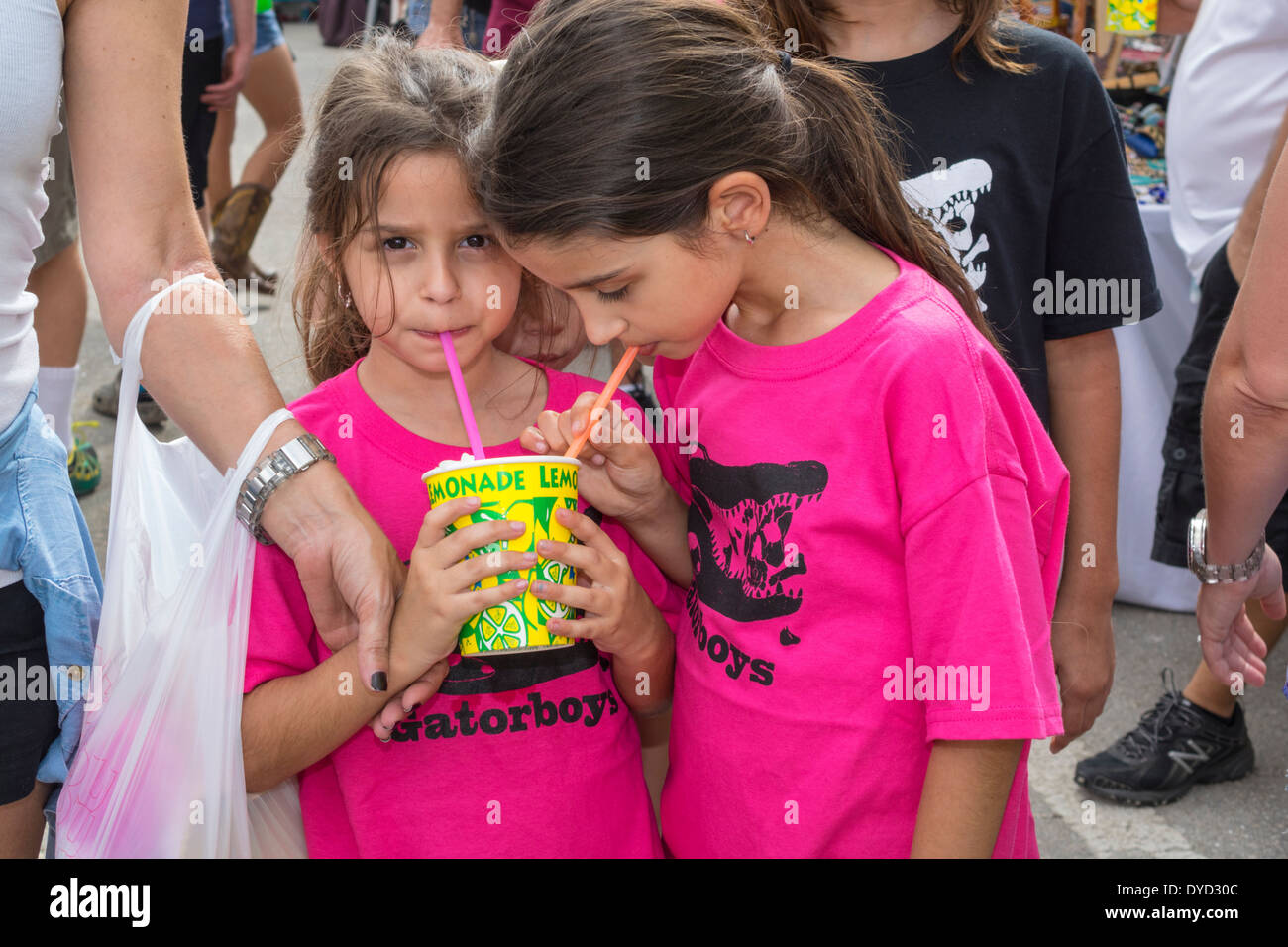 Everglades City Florida,Seafood Festival,girl girls,youngster youngsters youth youths female kid kids child children,sisters,siblings,sipping,st Stock Photo