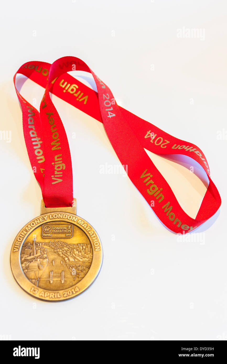 London UK. 13 April 2014 London Virgin Money Marathon medal and ribbon awarded to those runners who completed the course Credit:  John Henshall/Alamy Live News JMH6160 Stock Photo