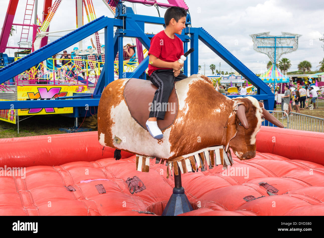 Everglades City Florida,Seafood Festival,annual community event,carnival game,mechanical bull,riding,Hispanic Latin Latino ethnic immigrant immi Stock Photo