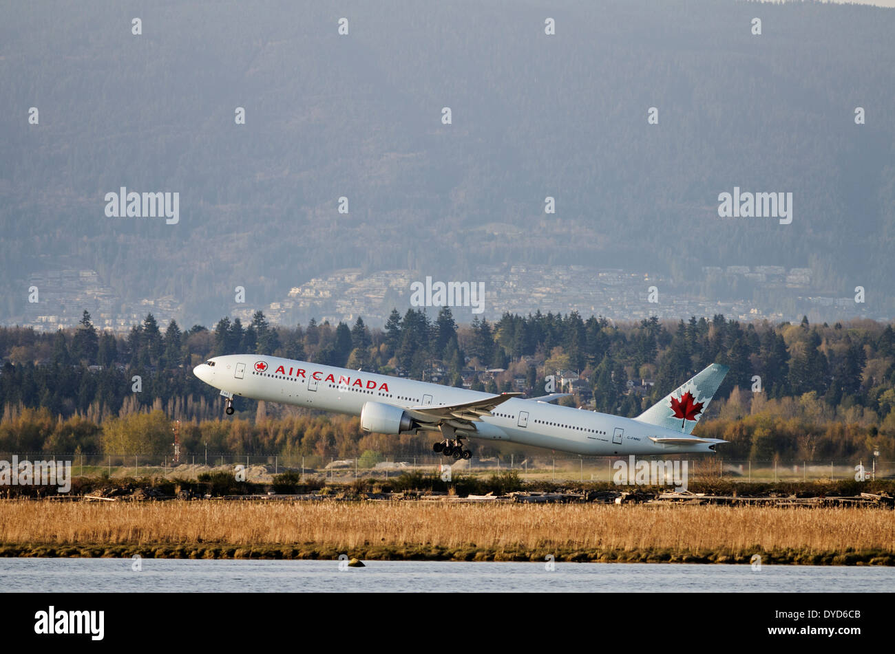 An Air Canada Boeing 777 (777-300ER) jetliner takes off from Vancouver International Airport Stock Photo