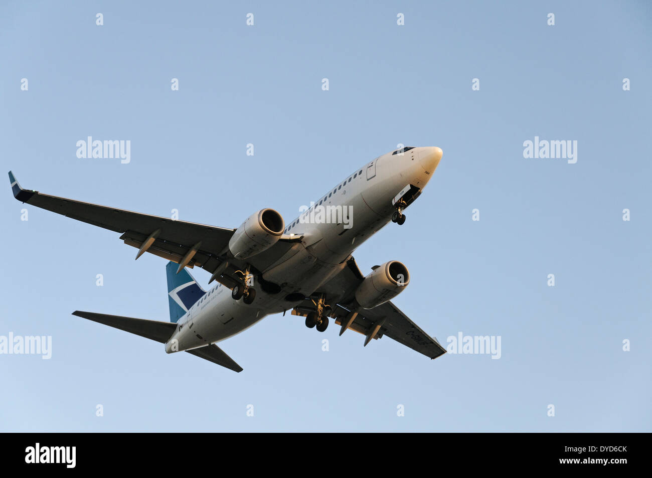 A Westjet Airlines Boeing 737 (737-700) narrow-body jetliner on final approach for landing at Vancouver International Airport Stock Photo