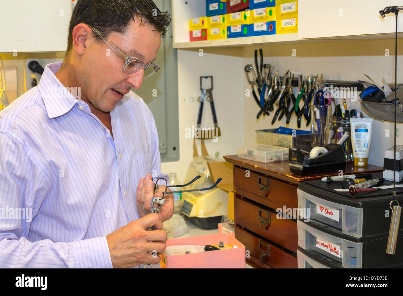 Miami Beach Florida,optician,adult adults man men male,working,work,adjusting,eye glasses,using