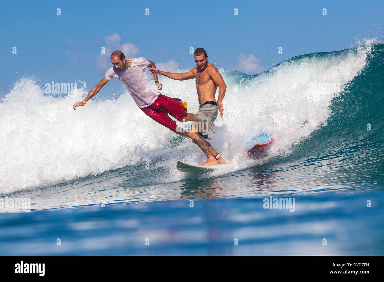 Surfing a wave.Indonesia. Stock Photo