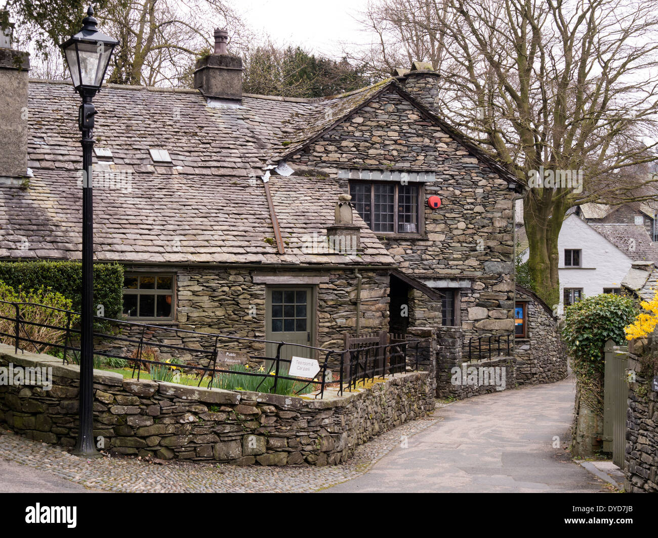 Old traditional Lakeland cottages with slate dry stone walls and roofs. Grasmere, Cumbria, England, UK Stock Photo