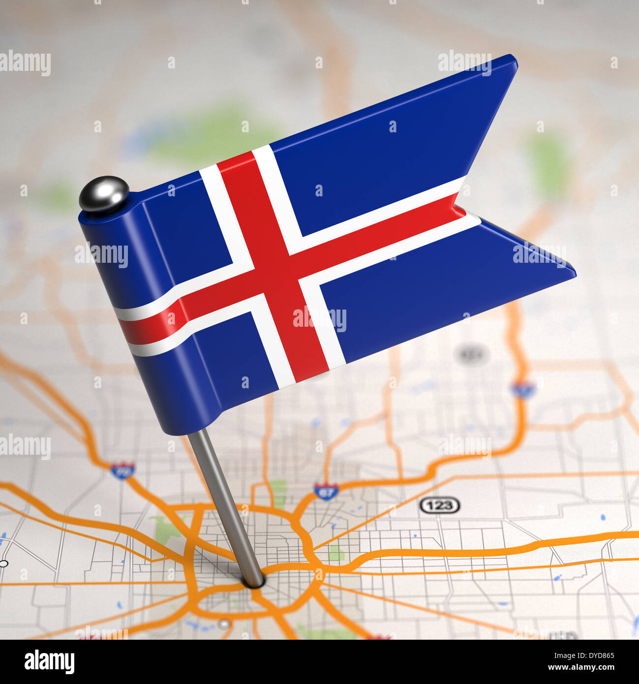 Small Flag of Iceland Sticked in the Map Background with Selective Focus. Stock Photo