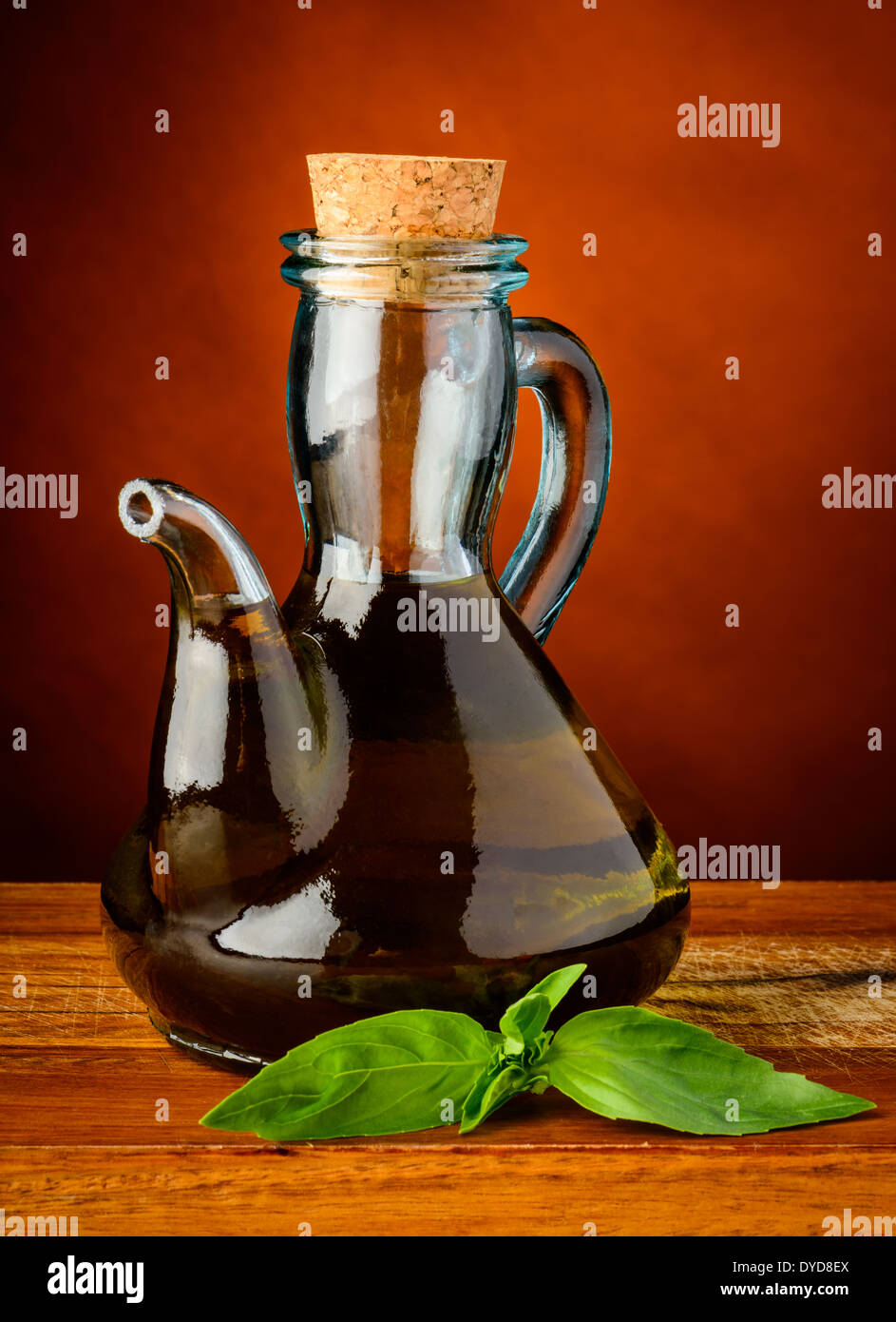 bottle of extra virgin olive oil and fresh green basil Stock Photo - Alamy