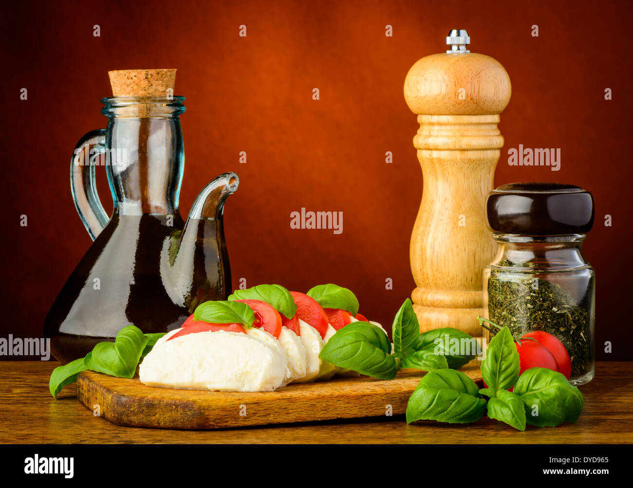still life with capreses salad, olive oil, herbs and spices Stock Photo