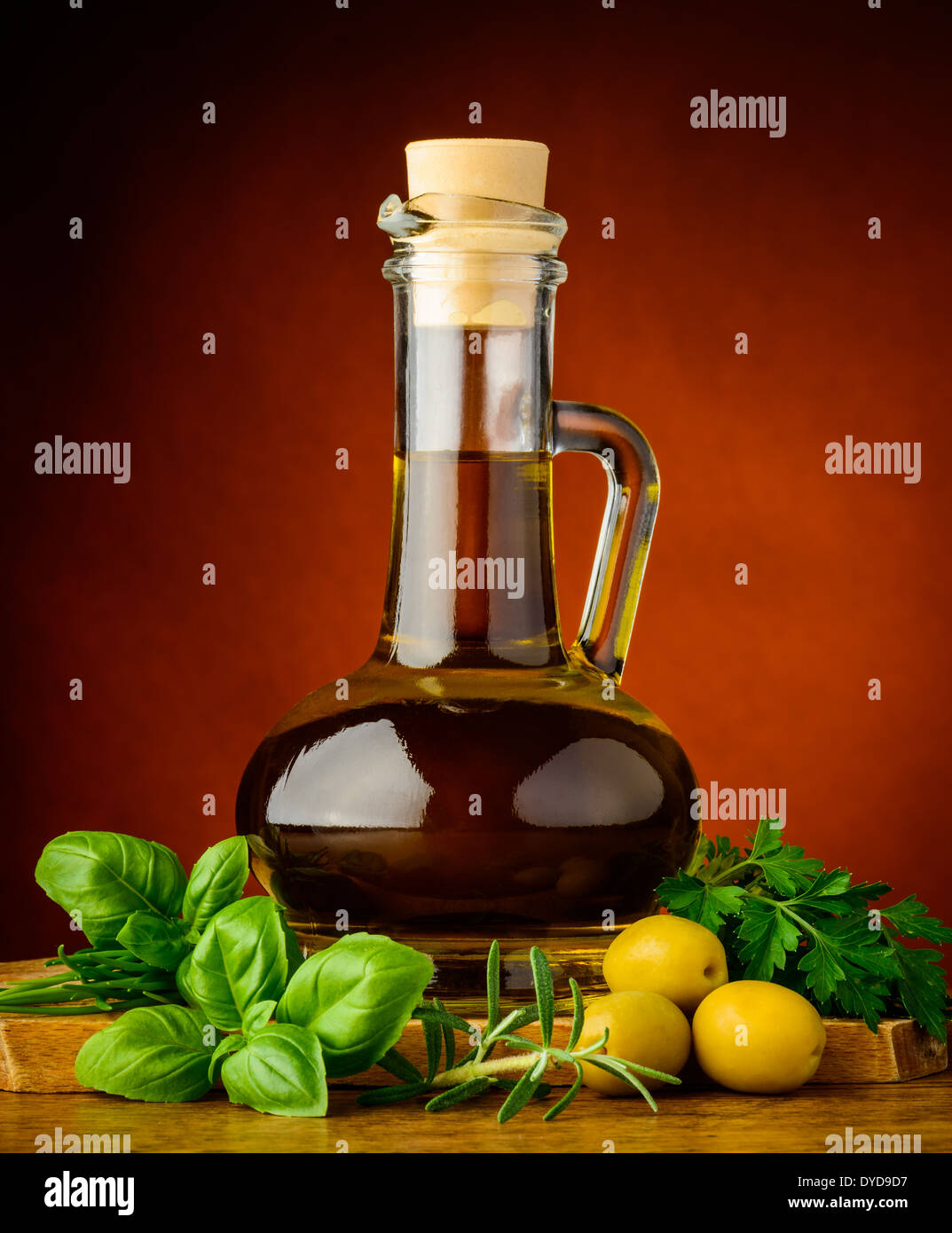 bottle of extra virgin olive oil and fresh green herbs Stock Photo - Alamy