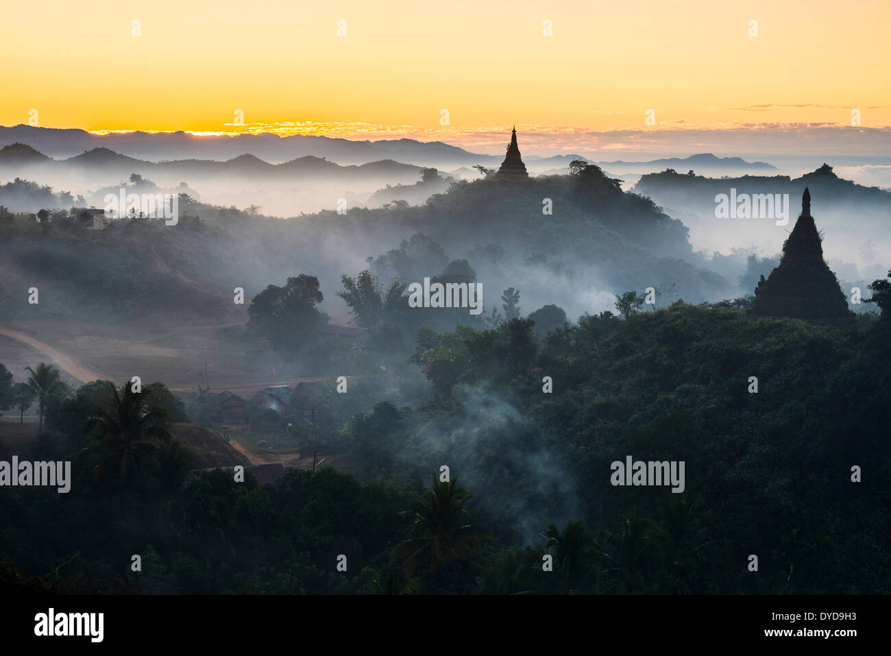 Pagodas surrounded by trees, in the mist, Mrauk U, Sittwe District, Rakhine State, Myanmar Stock Photo