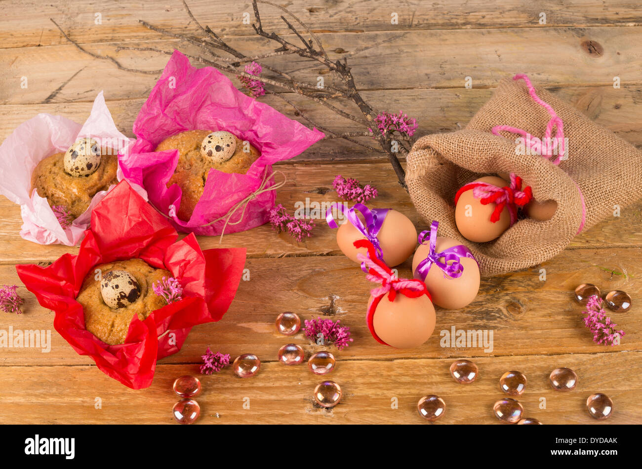 Still life with Easter eggs and small mona de Pascua cakes Stock Photo