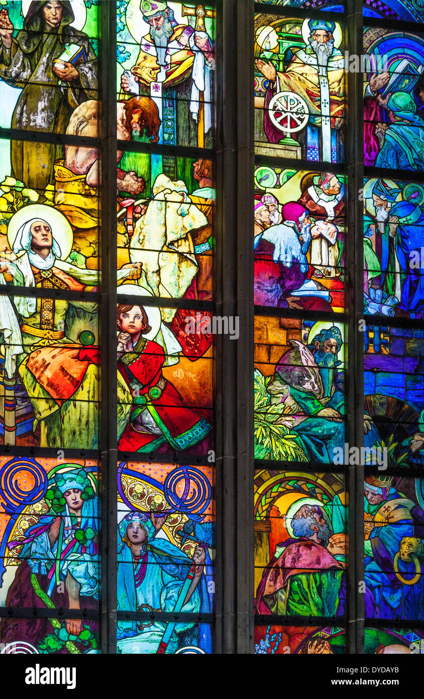 Part of the stained glass window by Alphonse Mucha in St Vitus Cathedral in Prague. Stock Photo