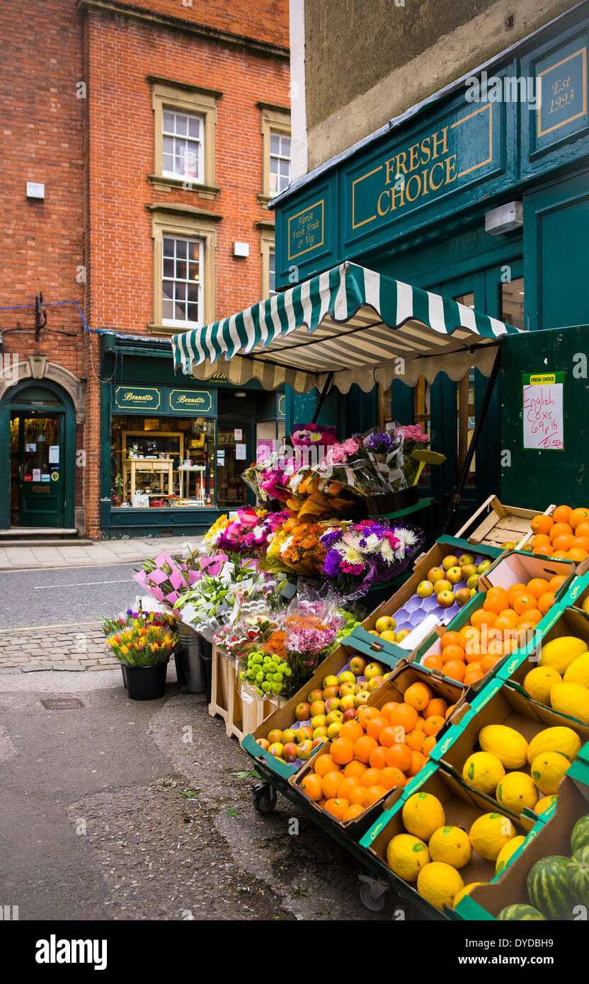 Fruit and flowers displayed outside an independent greengrocer's shop ...