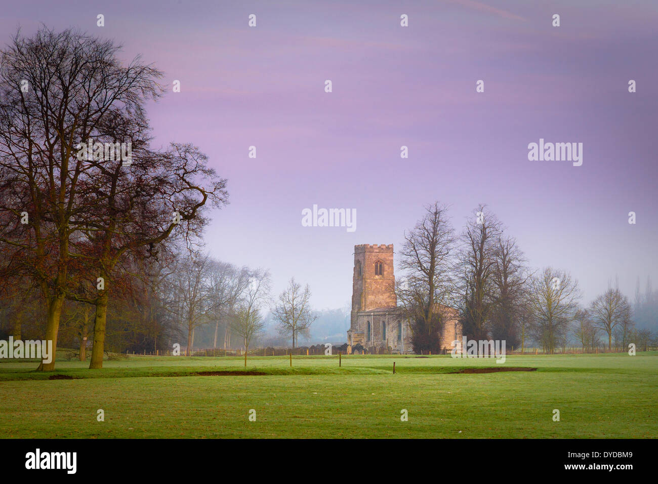 View of Wistow Church across meadows. Stock Photo