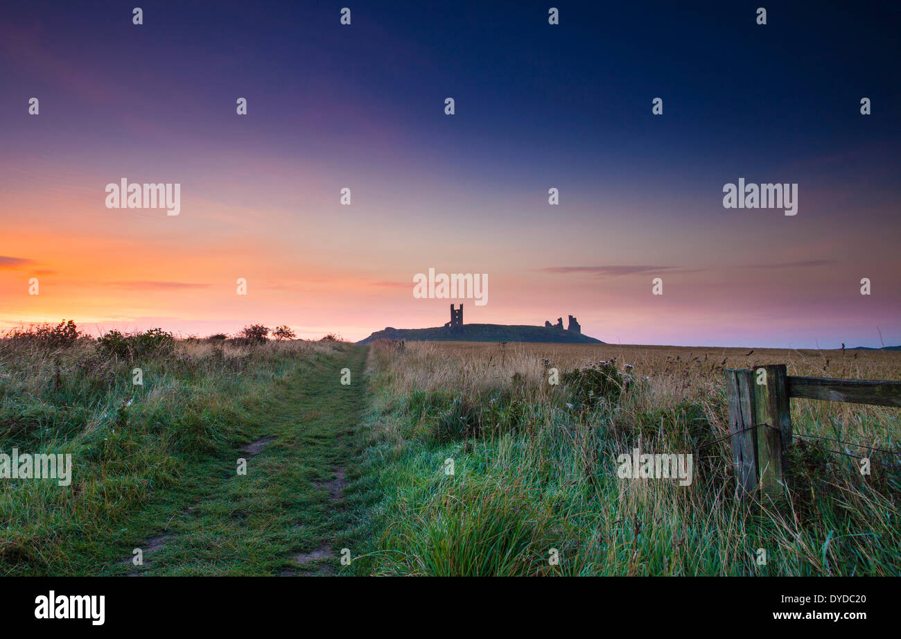 Dunstanburgh castle in Northumberland. Stock Photo