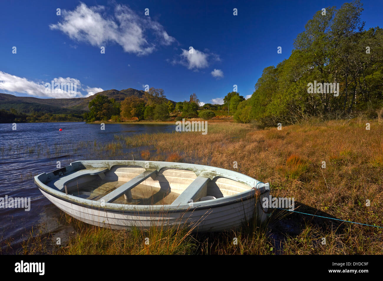 A boat on the shore of Loch Achray. Stock Photo