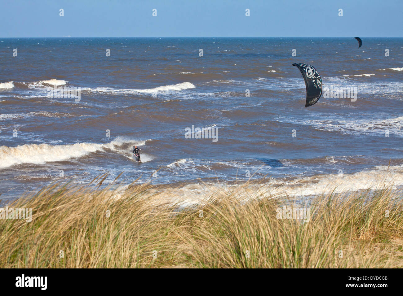 Kite surfing at Sea Palling on the Norfolk coast. Stock Photo