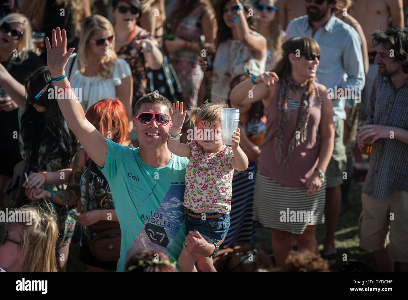 A father and daughter at the Brownstock Festival in Essex. Stock Photo