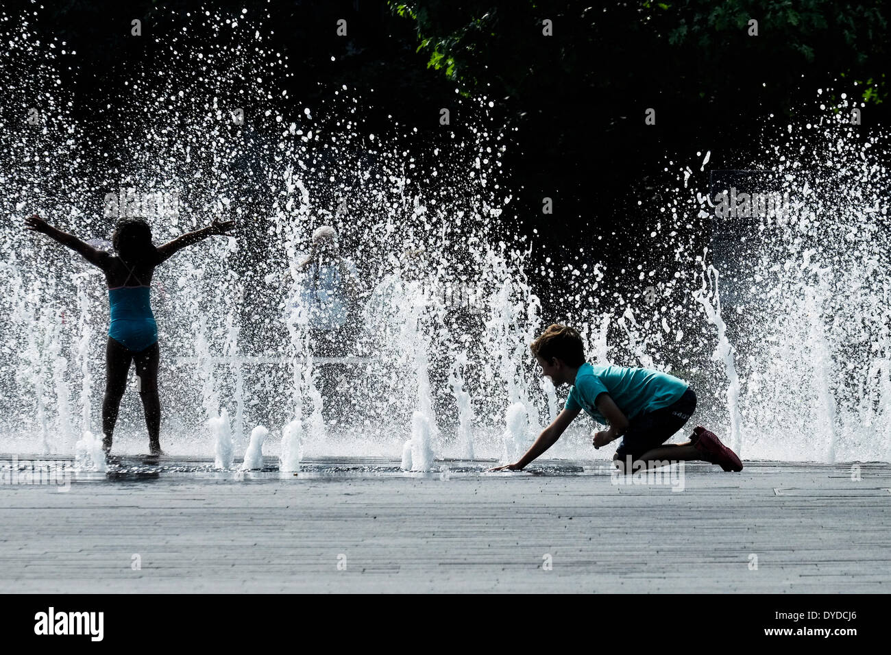 Children playing in the fountains on the South Bank in London. Stock Photo