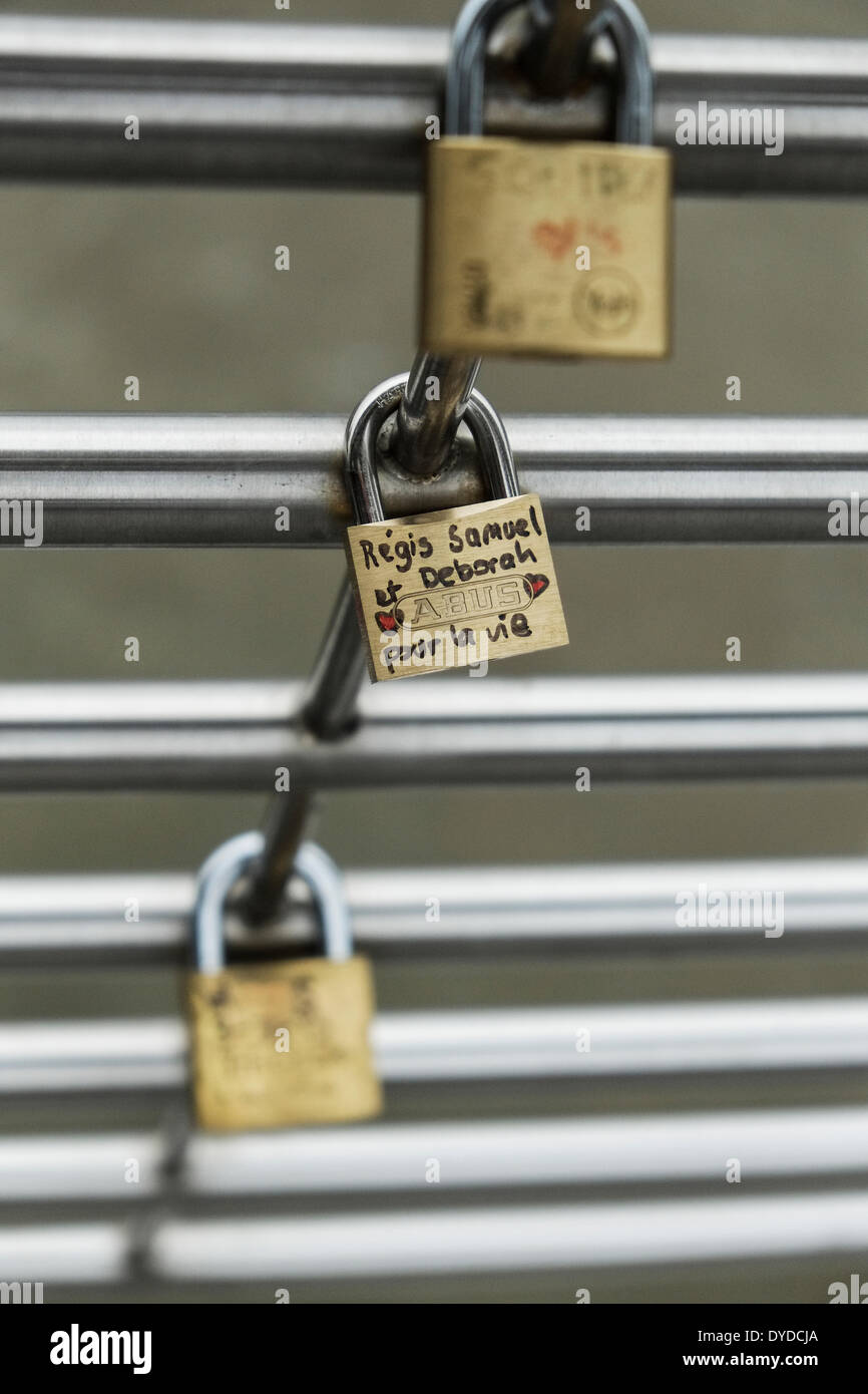 Love padlocks attached to the Golden Jubilee Bridge in London. Stock Photo
