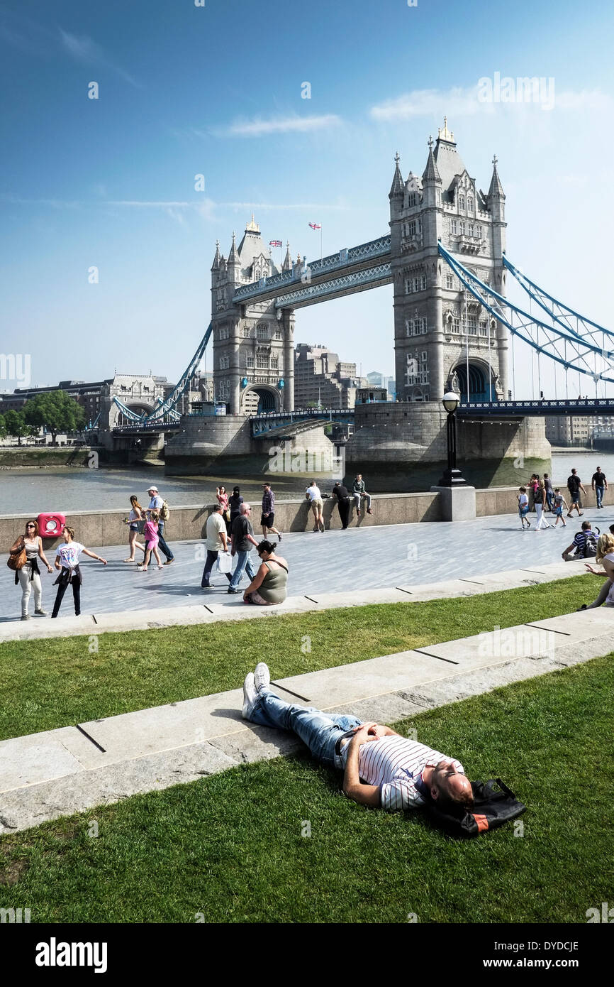 People relaxing on the South Bank in London. Stock Photo