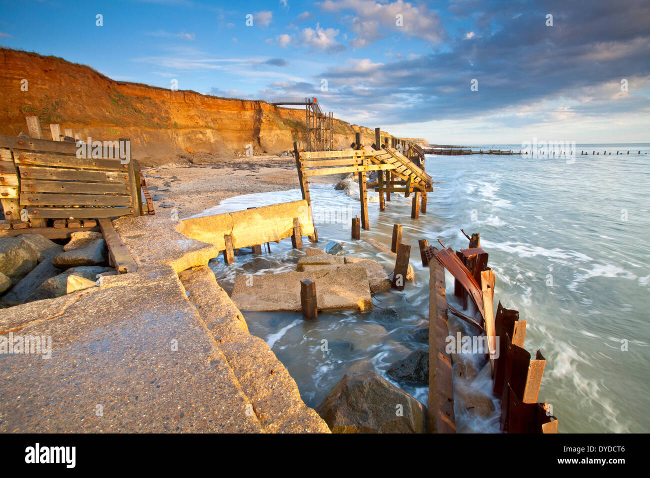 Happisburgh beach and the derelict sea defences at first light on the Norfolk coast. Stock Photo