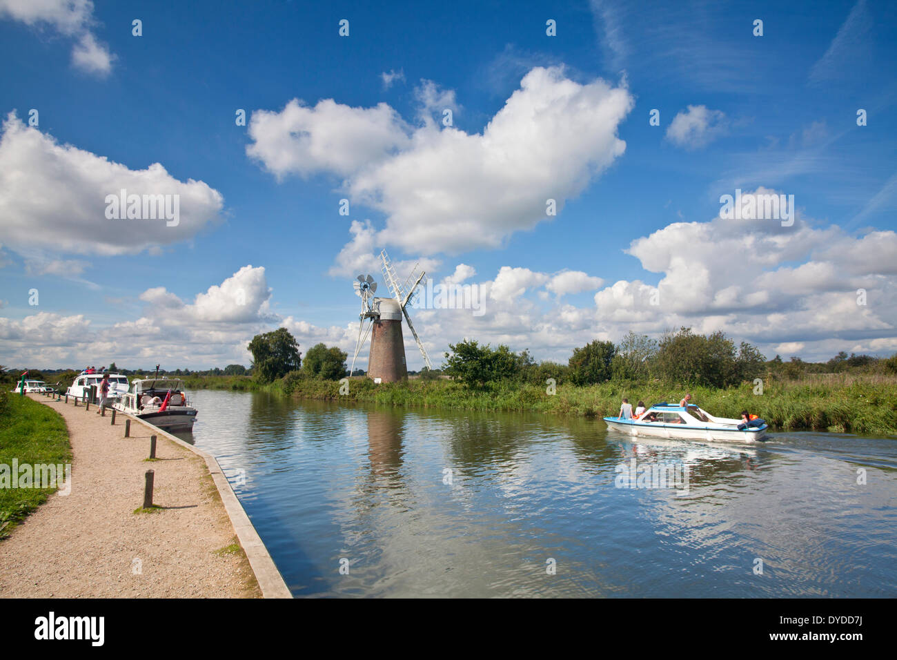 Turf Fen Mill and boats on the River Ant in the Norfolk Broads. Stock Photo