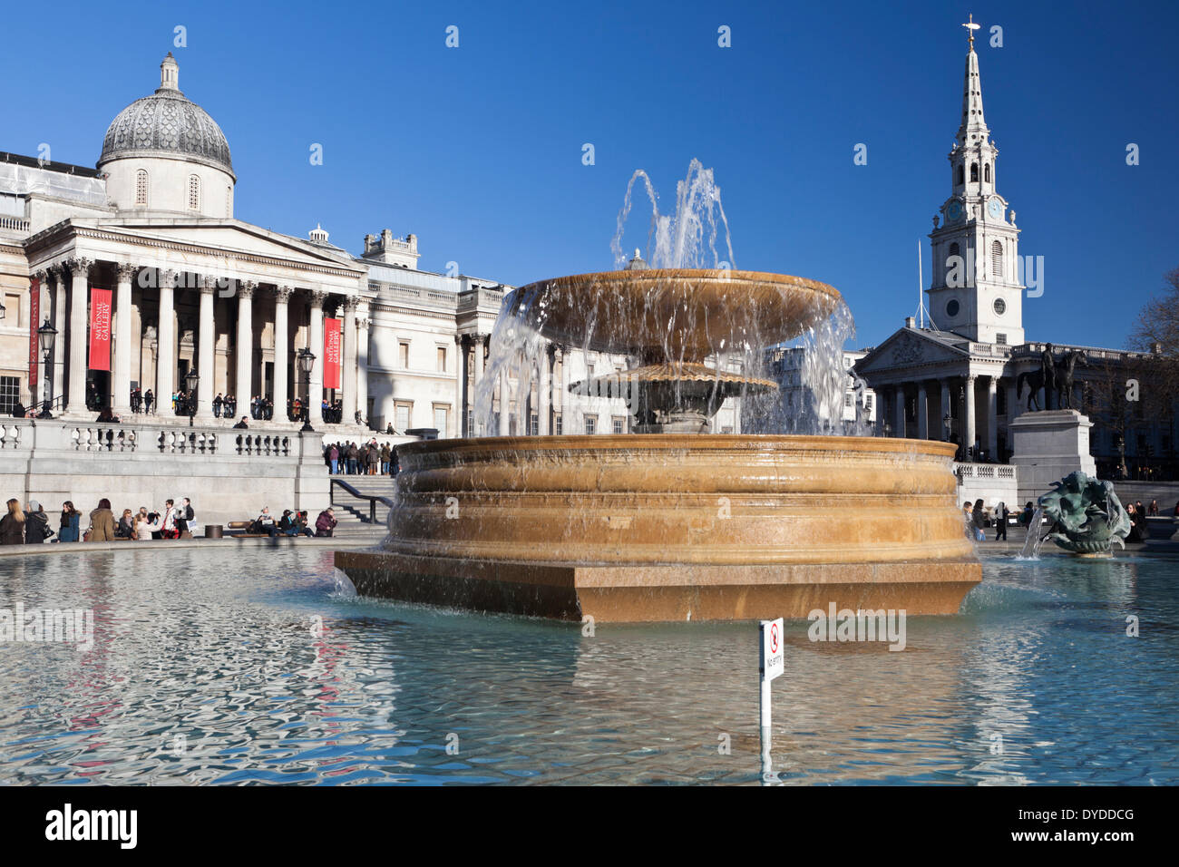 Fountain with the National Gallery and St Martin in the Fields church in the background. Stock Photo