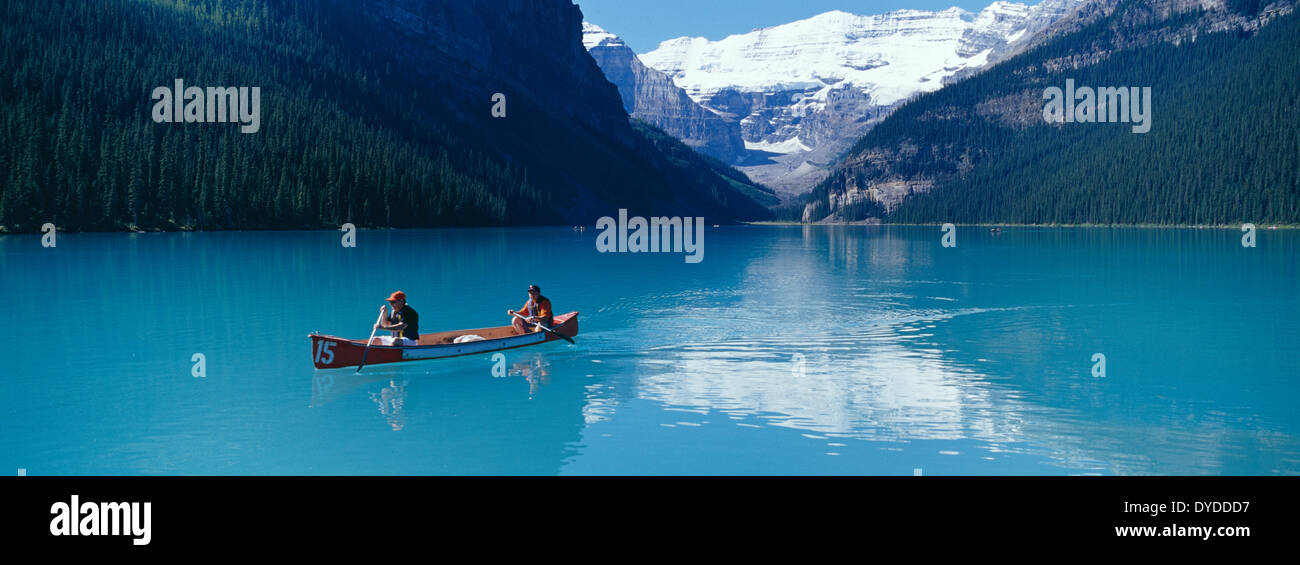 Canoeists on Lake Louise in Canada. Stock Photo