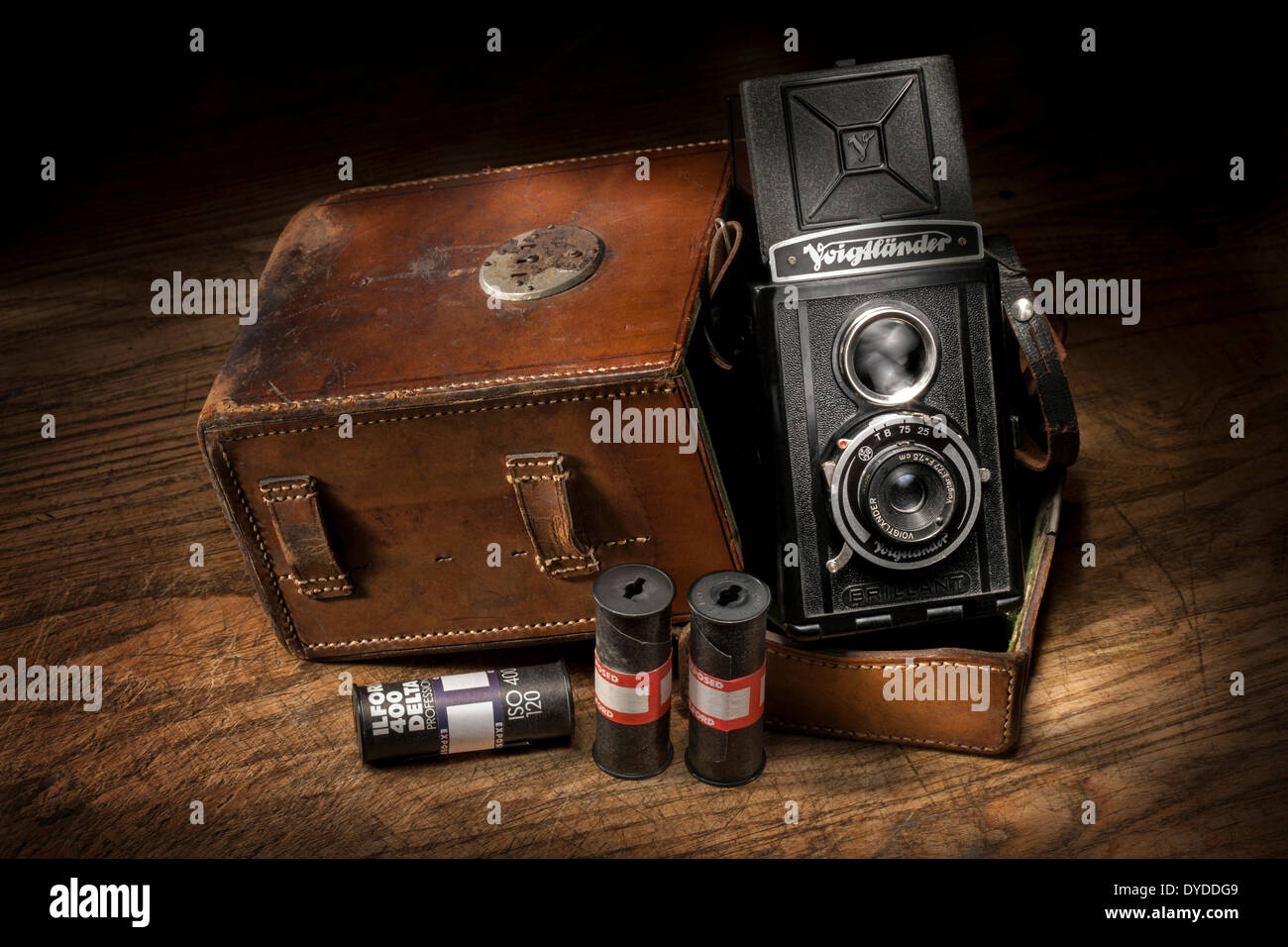 Vintage Voigtlander Brilliant camera with leather case and roll films. Stock Photo