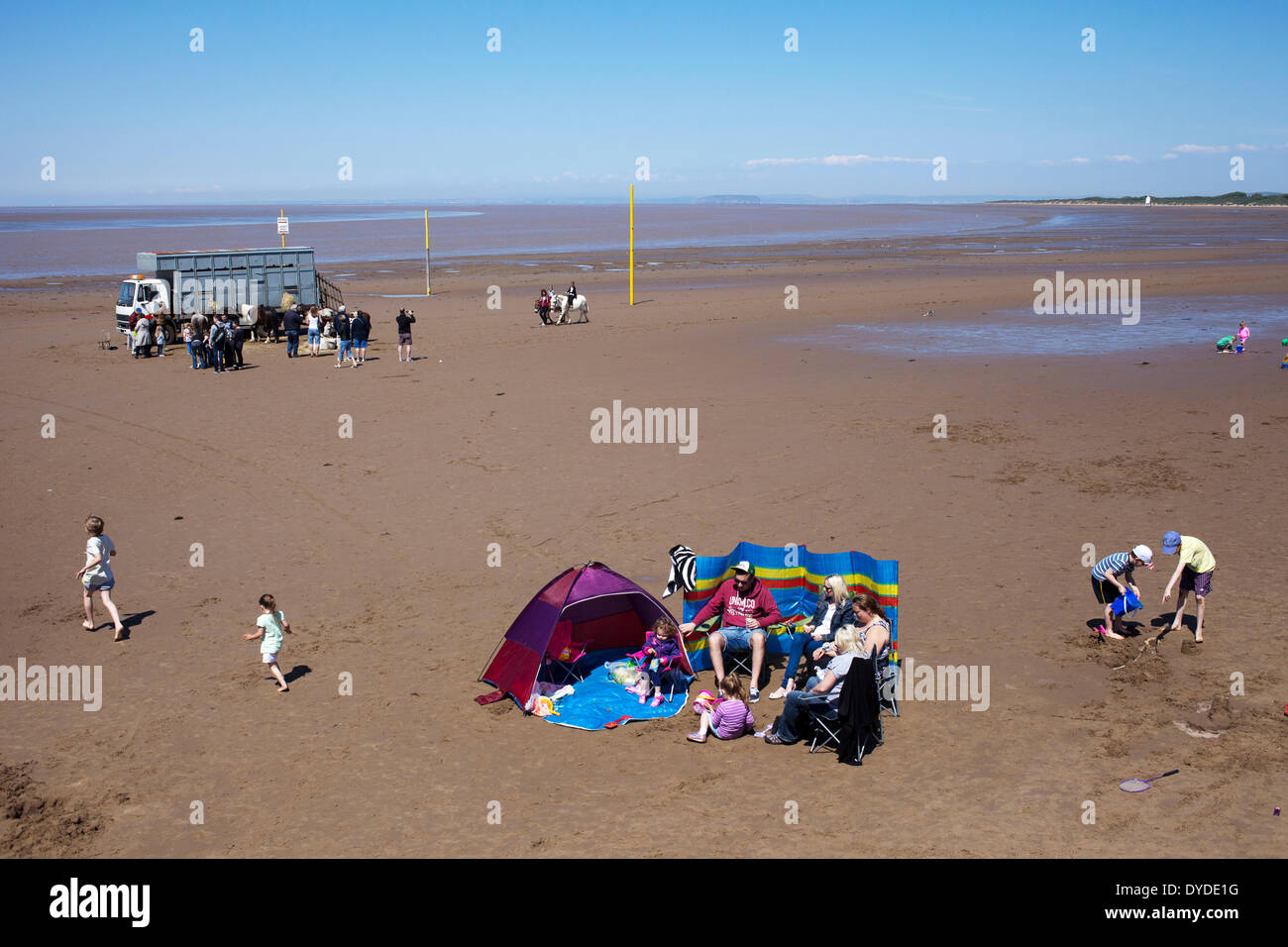 People on Burnham on Sea beach. Stock Photo