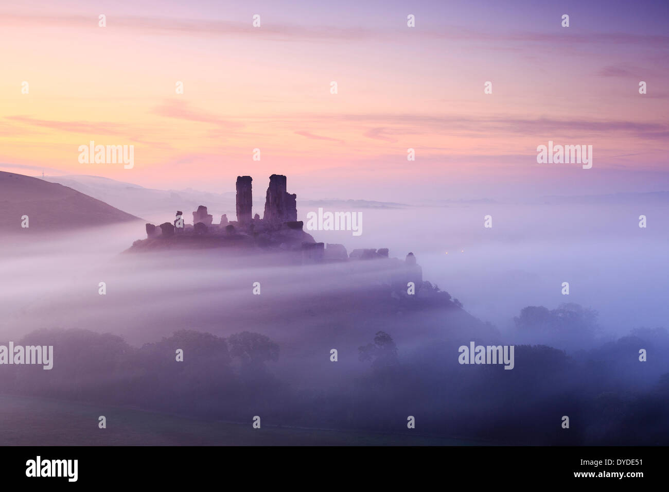 Corfe Castle in Dorset on a misty morning. Stock Photo