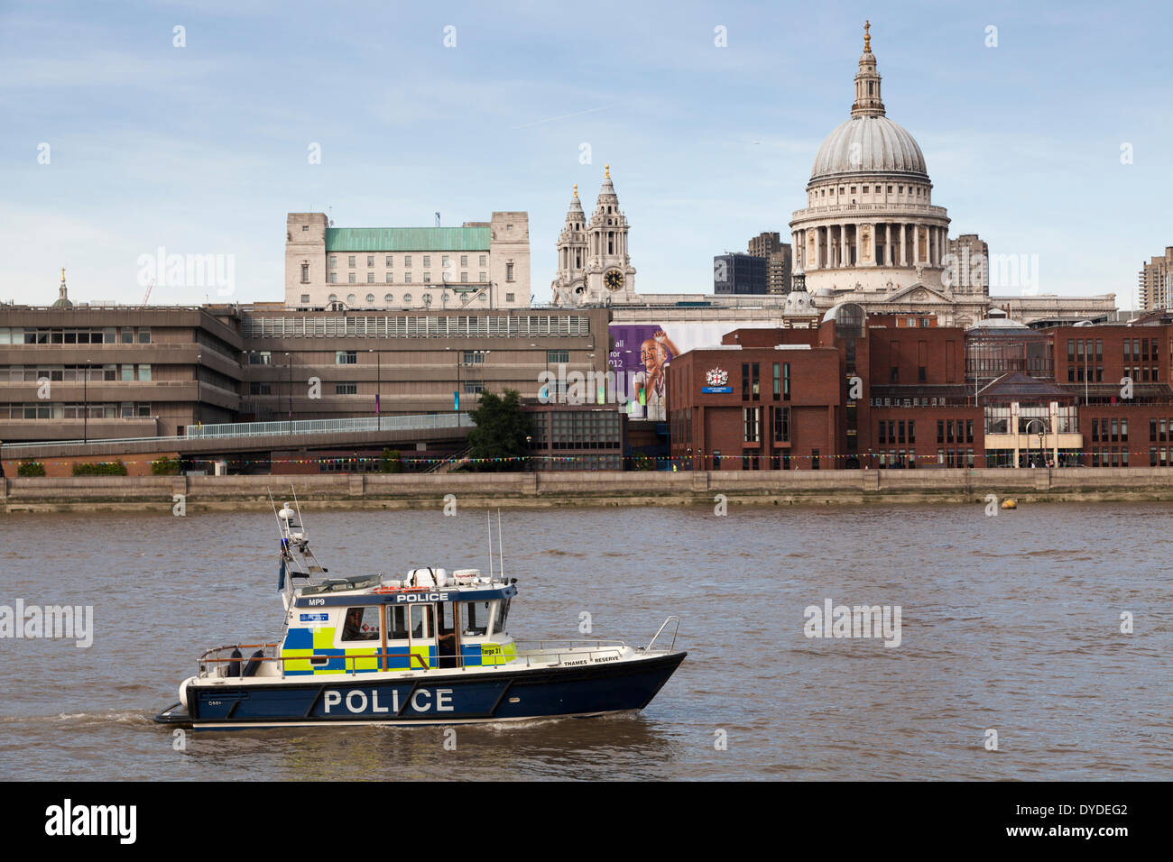 Police launch on the River Thames with St Paul's dome behind. Stock Photo