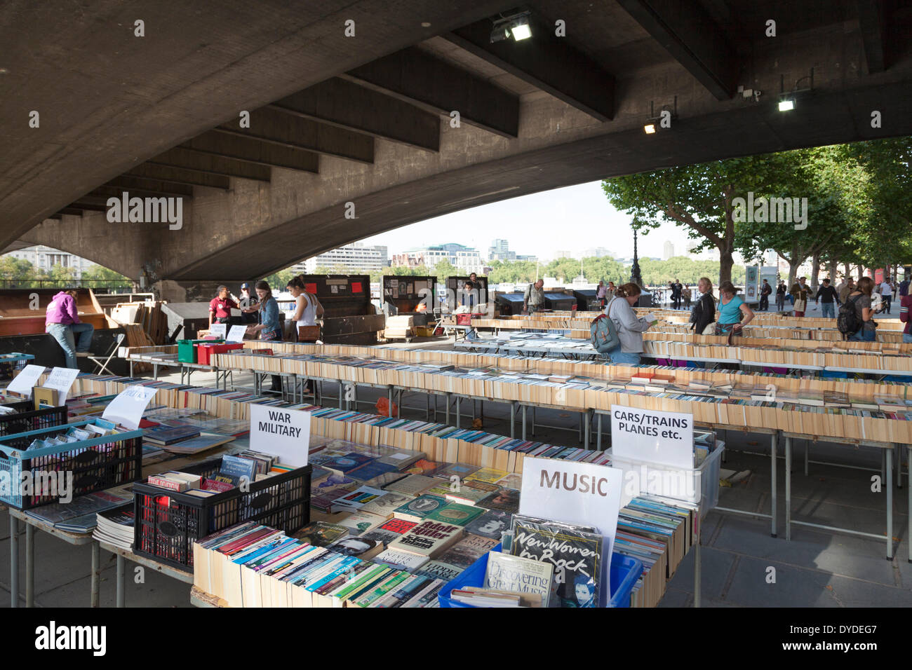 Second hand book stall under Waterloo bridge on the South Bank of the Thames in London. Stock Photo