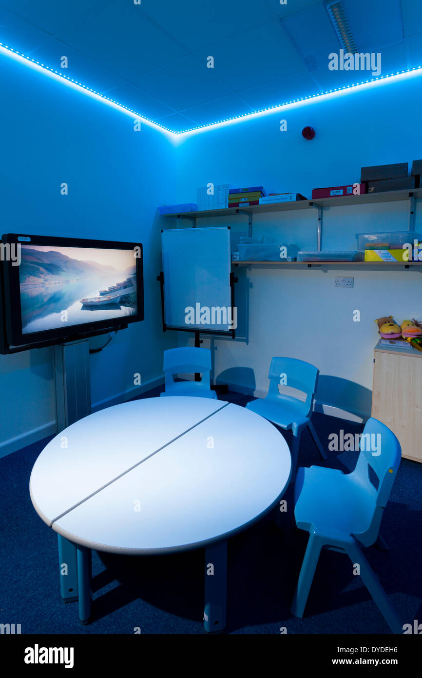 Blue sensory lighting one to one classroom at special school. Stock Photo