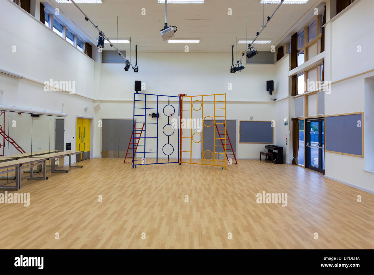 Wooden floored school hall with climbing equipment. Stock Photo