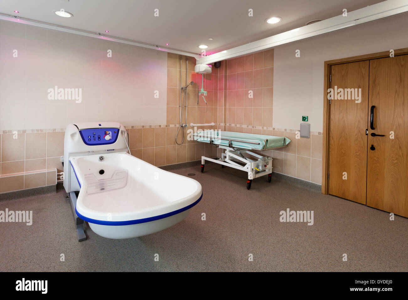Care home assisted bathroom with ceiling track hoist lifting gear and sensory lights. Stock Photo