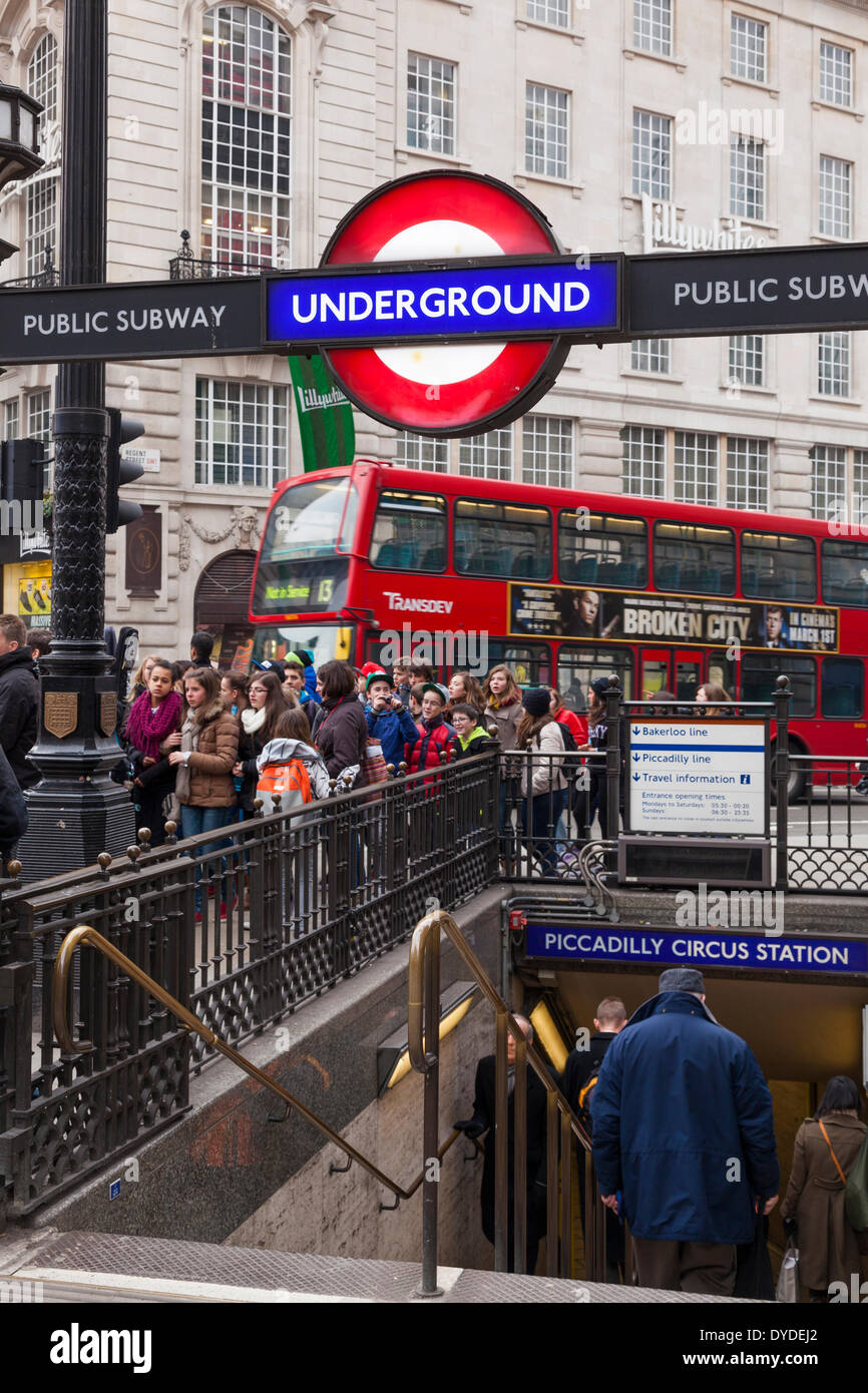Piccadilly Circus Underground station entrance and London red bus. Stock Photo