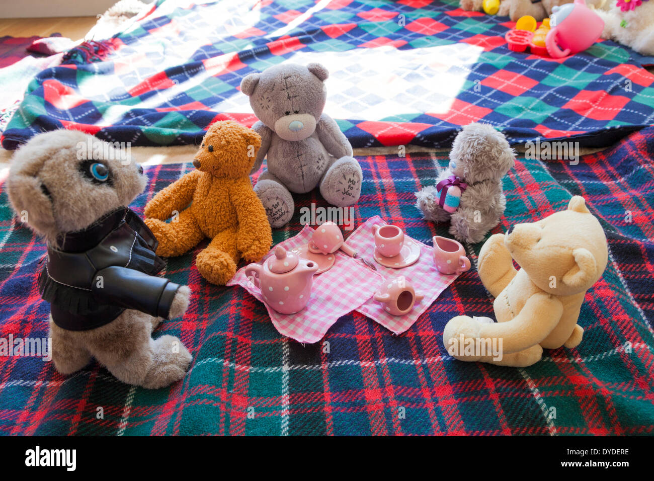 Soft toy set for a childrens teddy bears picnic on a blanket. Stock Photo