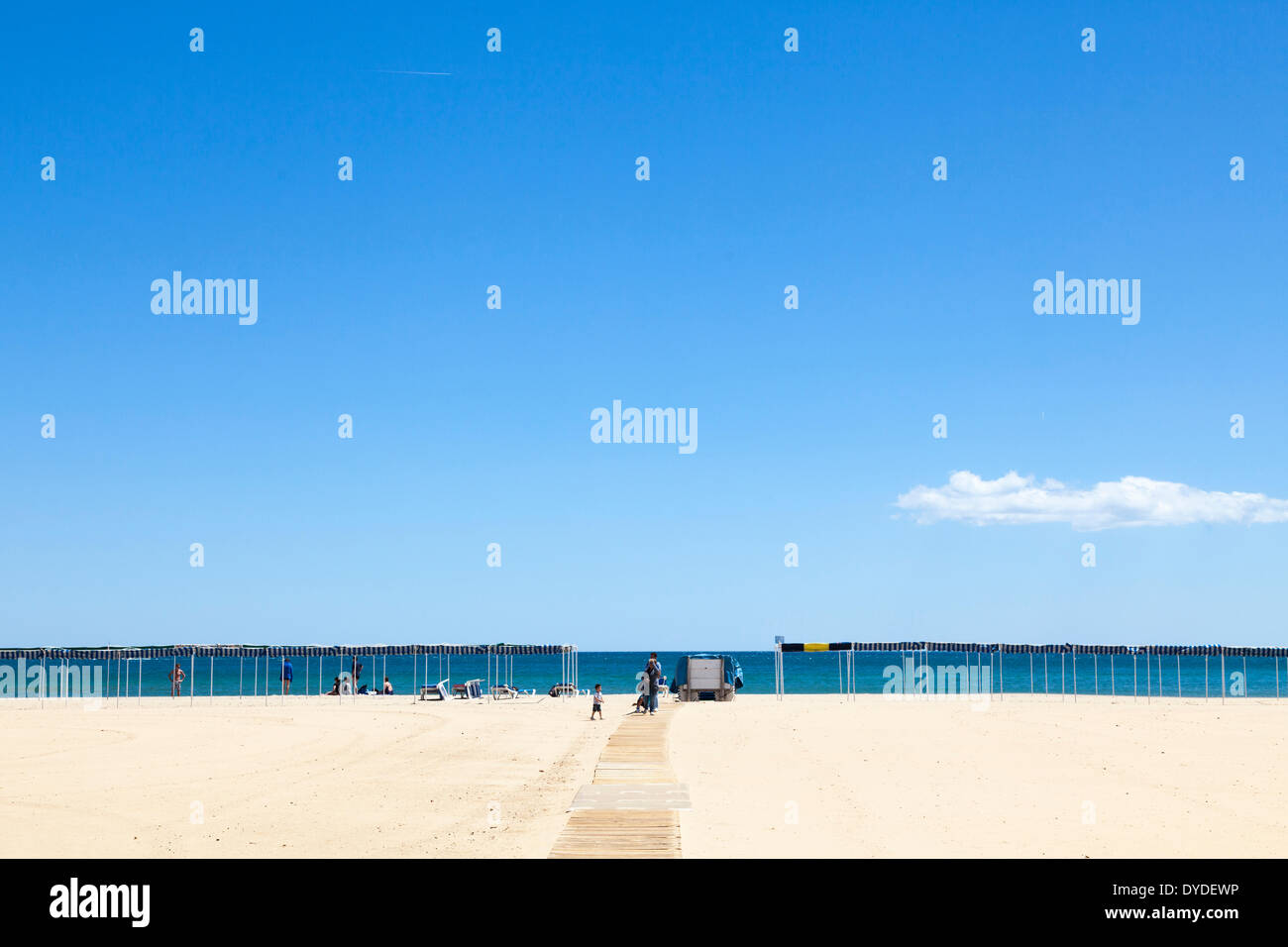 Slatted wood wheelchair access ramp to beach at Cambrils in Spain. Stock Photo
