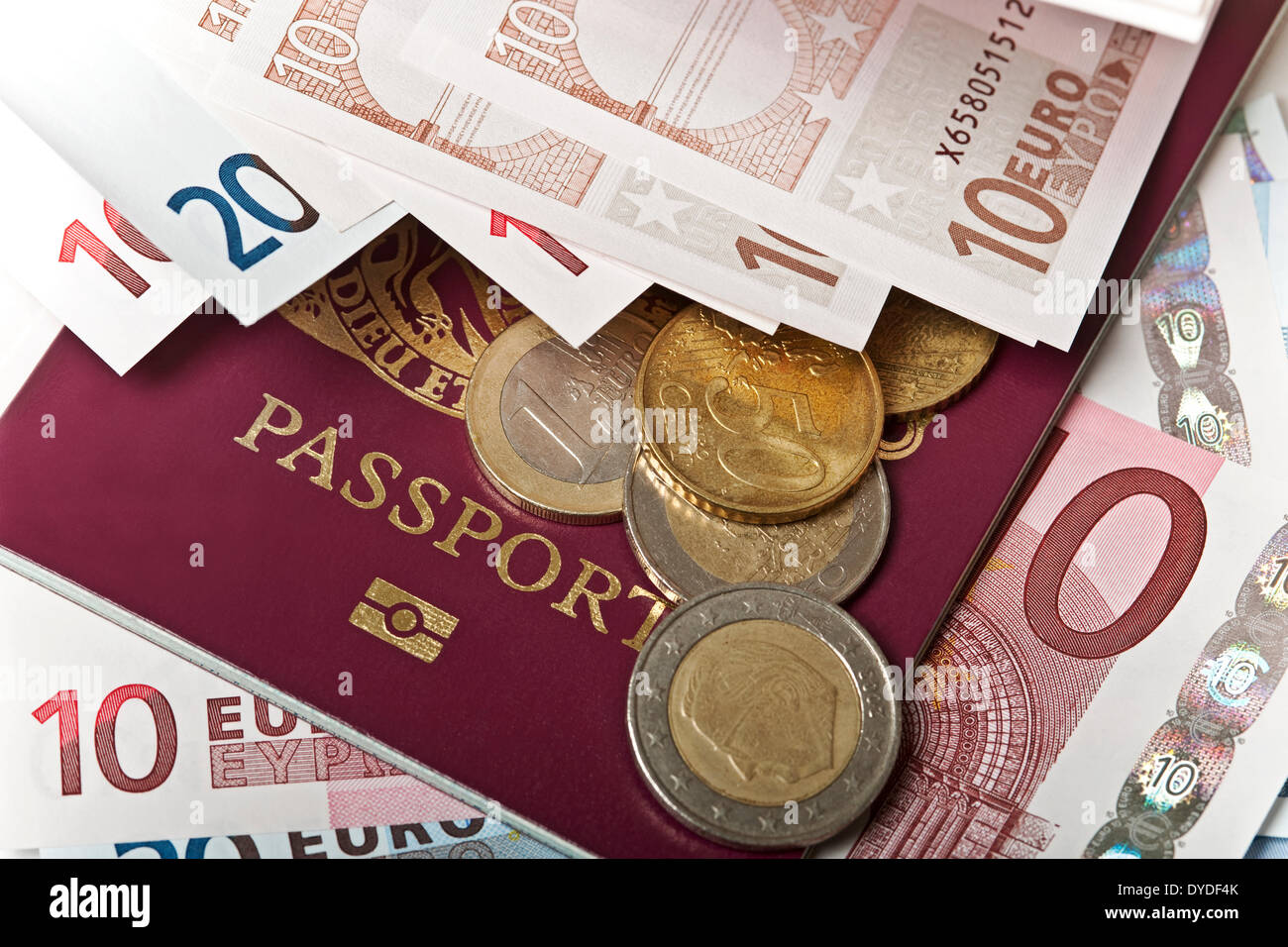 British passports with Euro coins and notes. Stock Photo