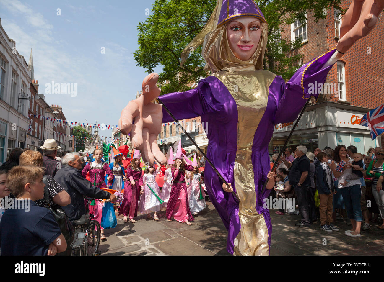 Giant carnival character of medieval lady in parade at Chichester city centre to celebrate the Queen's Diamond Jubilee. Stock Photo