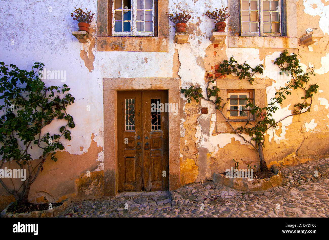 An ancient house in the medieval town of Obidos. Stock Photo