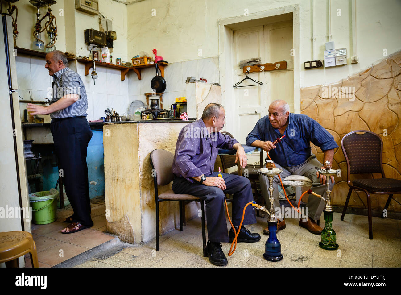 Arab men at a traditional cafe smoking water pipe, Nazareth, lower