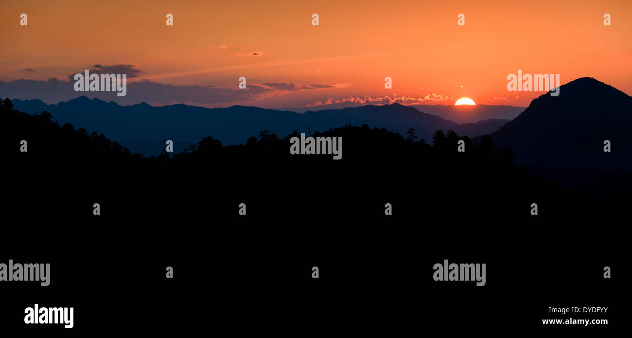 Sunset over the mountains seen from King Lom Check Point near Pai. Stock Photo