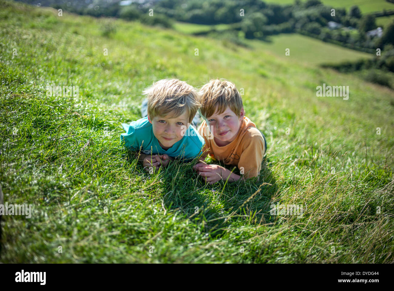 Two boys at the top of Glastonbury Tor. Stock Photo