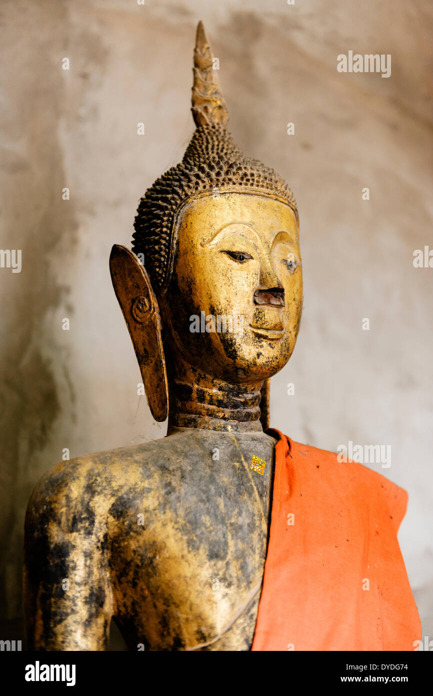 Buddha statue in Wat Xieng Thong at Luang Prabang in Laos. Stock Photo