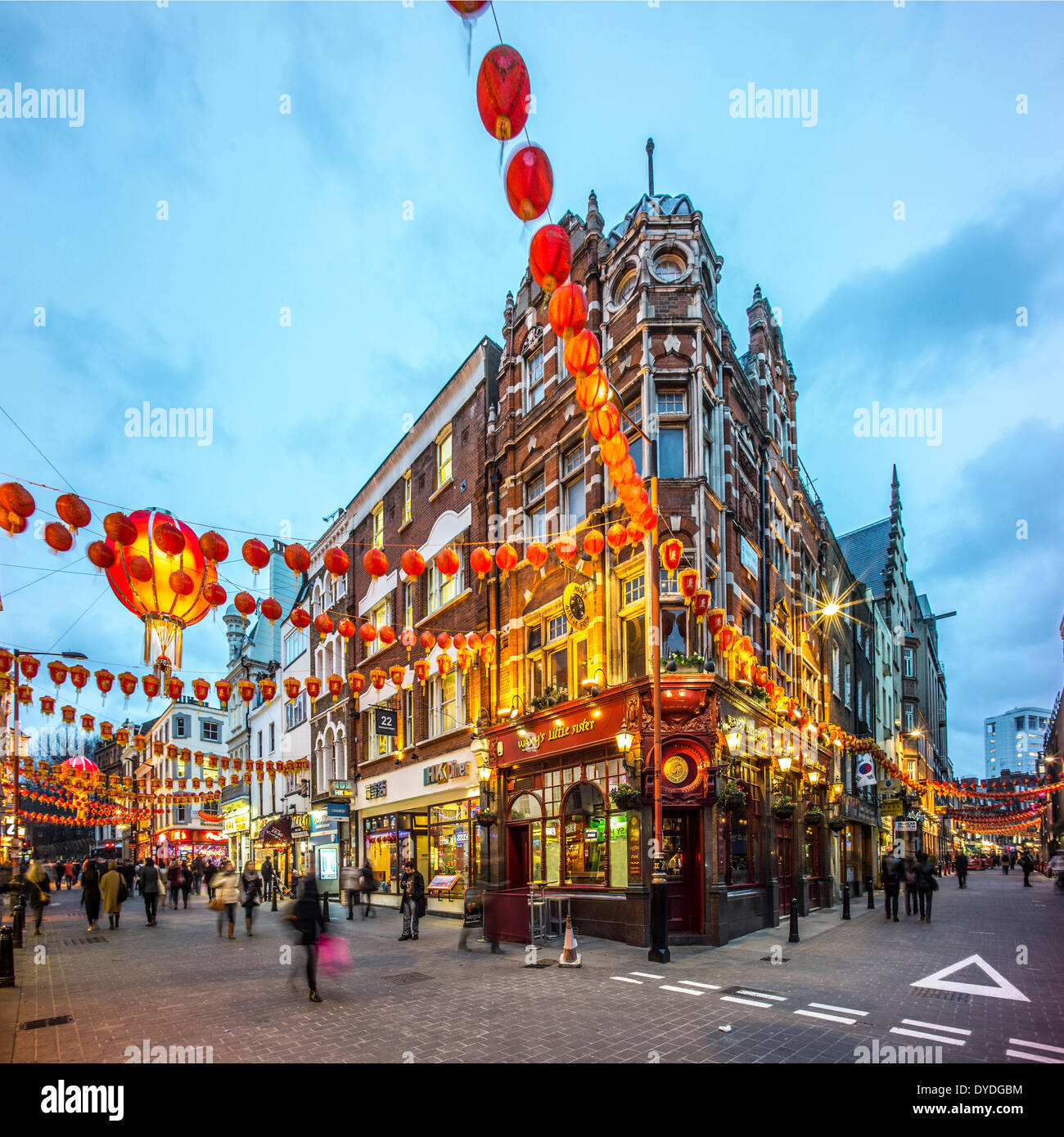 Decorations for Chinese New Year in Wardour Street in London at dusk. Stock Photo