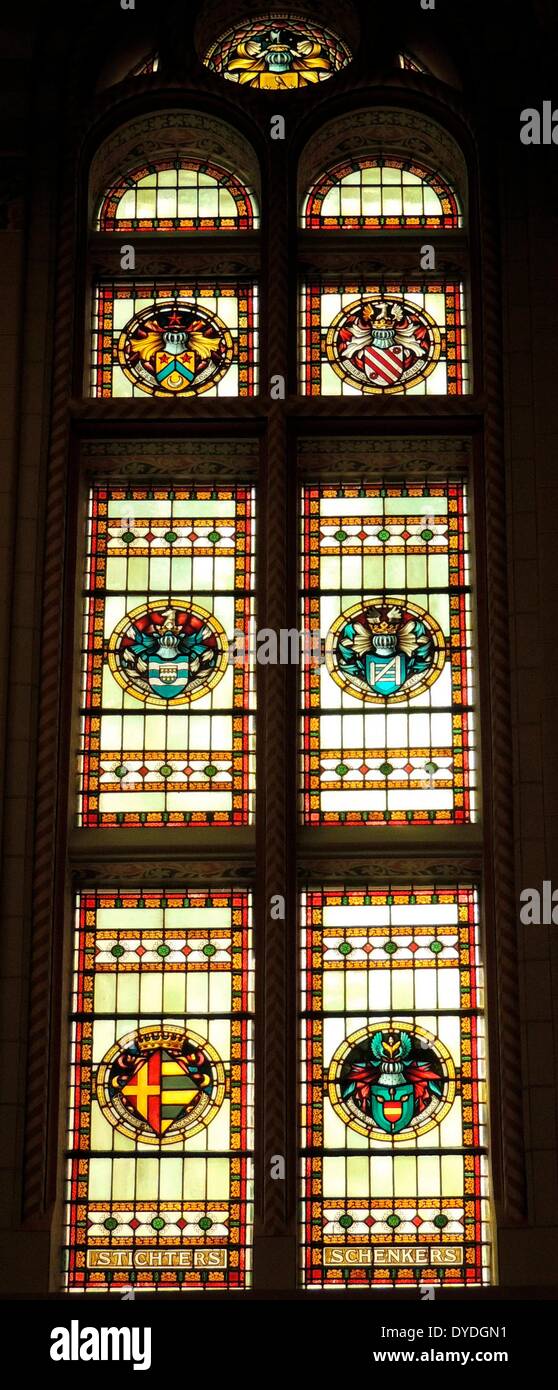 Stained glass window at the Rijksmuseum, Amsterdam, Holland. Depicts various heraldic shields and emblems Stock Photo